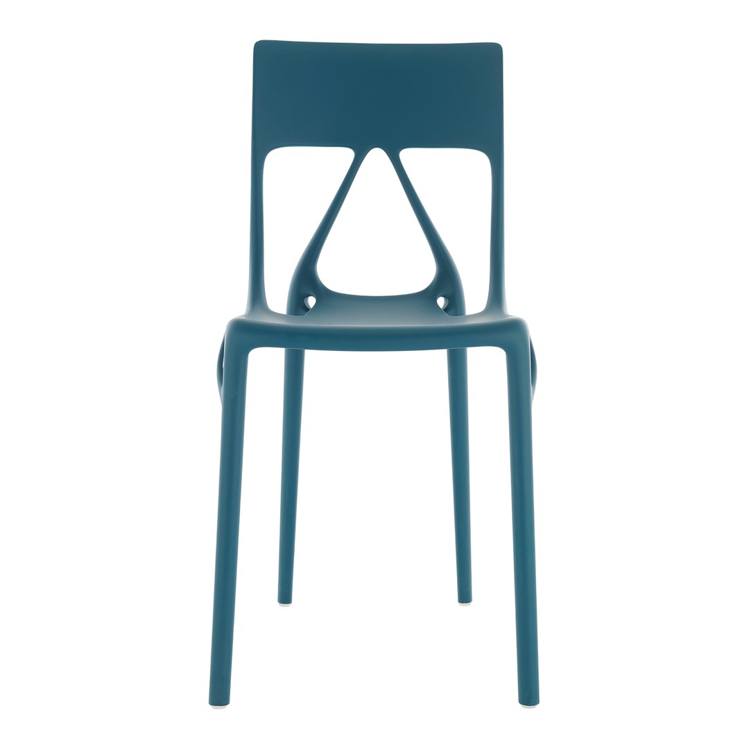 Modern teal plastic chair with a unique cutout design, featuring a smooth matte finish. Ideal for contemporary decor.