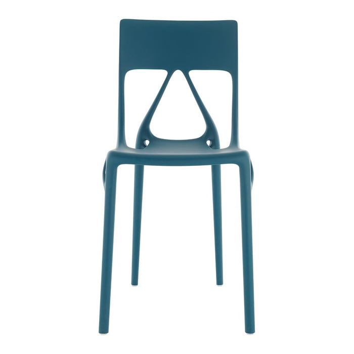 Modern teal plastic chair with a unique cutout design, featuring a smooth matte finish. Ideal for contemporary decor.