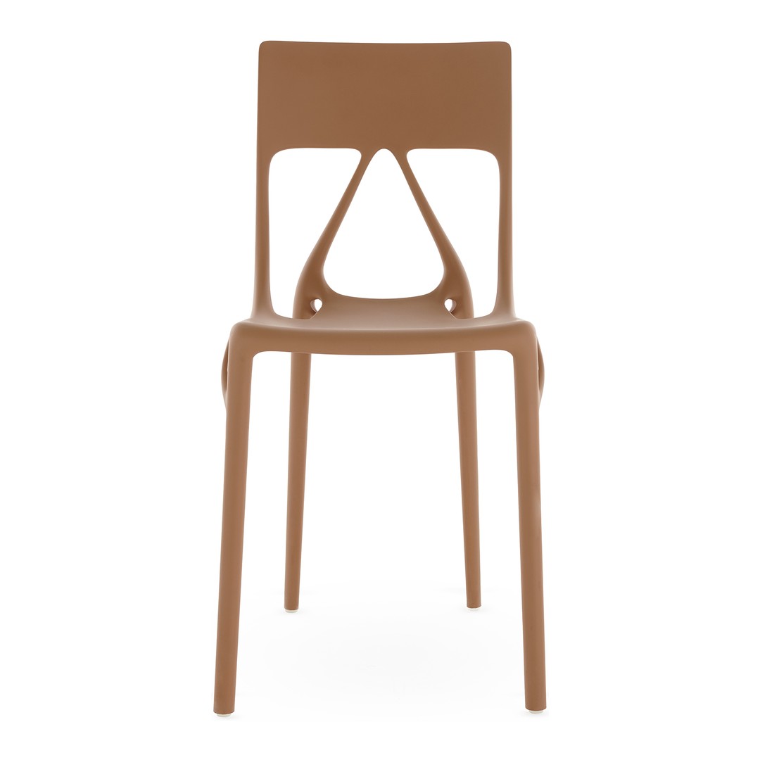 Brown plastic chair with unique cutout design, featuring a smooth, modern finish. Perfect for contemporary spaces.