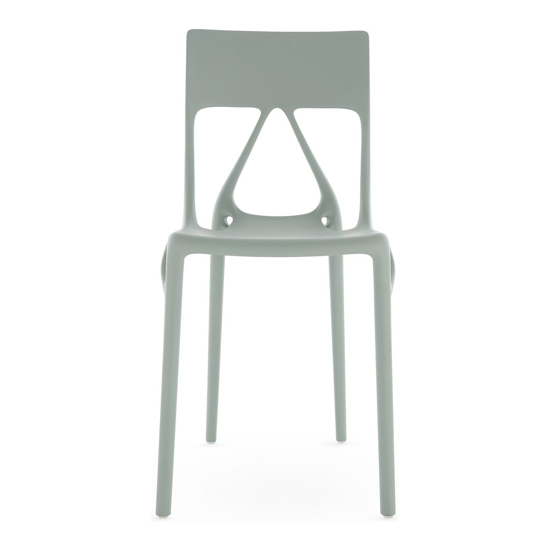 Light green modern chair with sleek design and minimalist pattern, perfect for contemporary spaces.