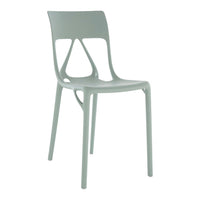 Light green chair with a modern design, featuring smooth curves and cutout patterns for a sleek look.