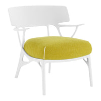 Modern chair with a sleek white frame and a plush, vibrant yellow seat cushion.