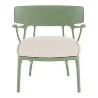 Green chair with soft cream-colored seat, accented by a textured pattern and smooth, sleek lines.