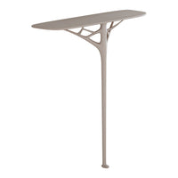 Sleek modern console table in soft beige with organic, branch-like design and smooth, elongated surface.