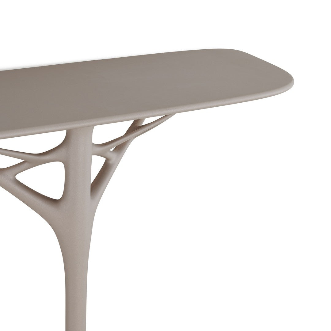Modern beige table with organic, tree-like design and smooth, minimalistic surface. Ideal for contemporary decor.