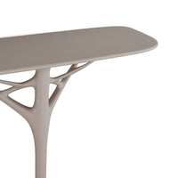 Modern beige table with organic, tree-like design and smooth, minimalistic surface. Ideal for contemporary decor.