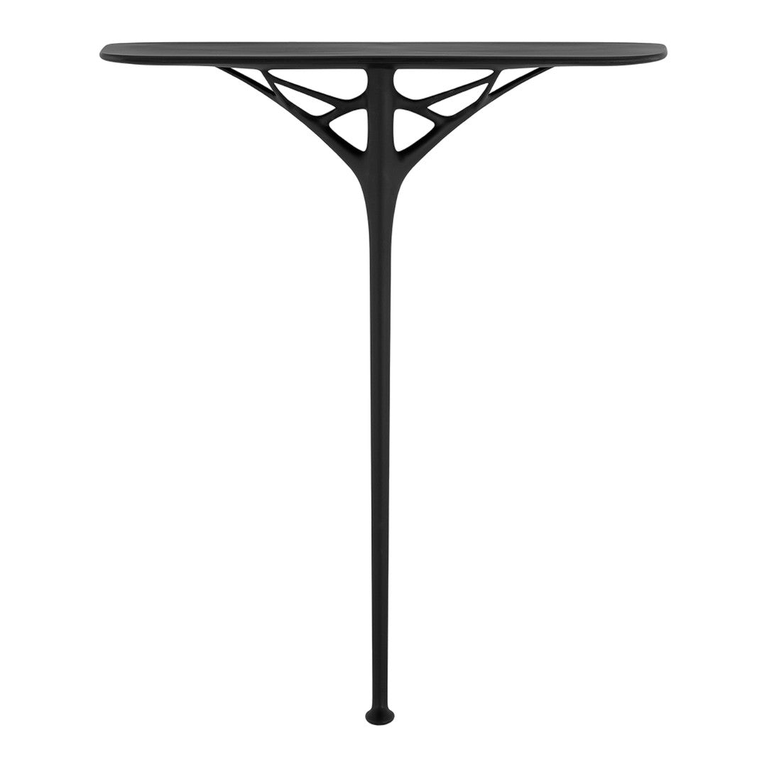 "Modern black table with a unique geometric base, featuring a sleek surface and intricate cut-out patterns."
