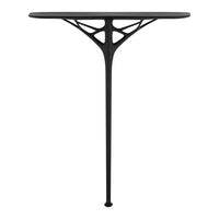 "Modern black table with a unique geometric base, featuring a sleek surface and intricate cut-out patterns."