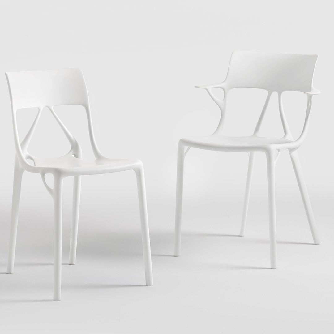 Set of two modern white chairs with a minimalist design and smooth, sleek finish. Perfect for any contemporary space.