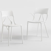 Set of two modern white chairs with a minimalist design and smooth, sleek finish. Perfect for any contemporary space.