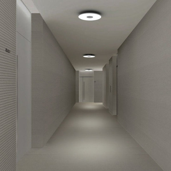 "Modern hallway featuring sleek gray walls and minimalist lighting for a clean, contemporary look."