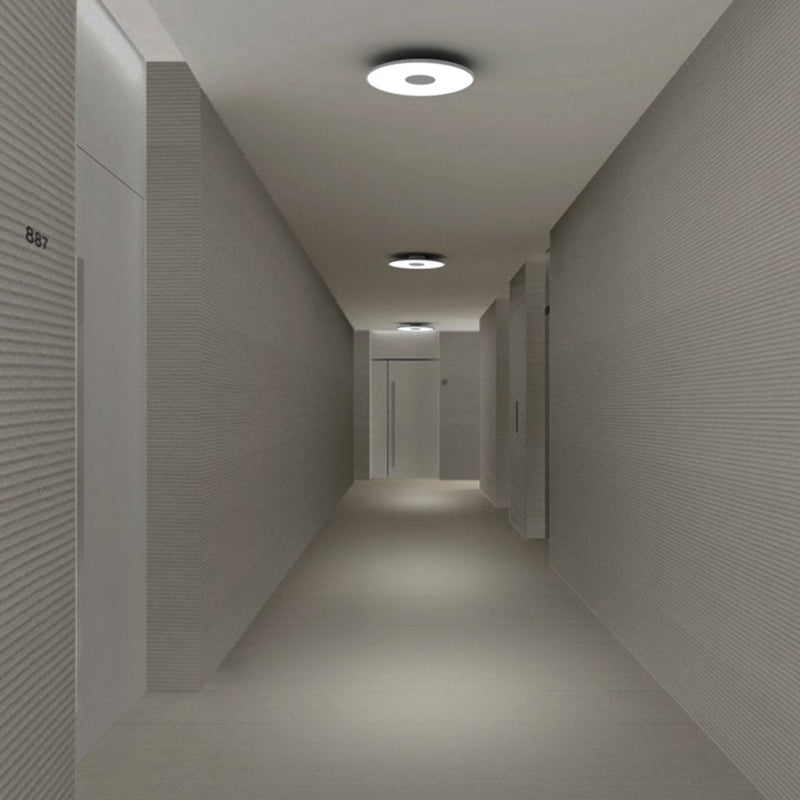 "Modern hallway featuring sleek gray walls and minimalist lighting for a clean, contemporary look."