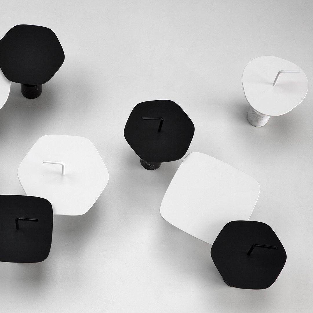 Black and white geometric shapes with hexagonal and square patterns on a light background. Modern minimalistic design.