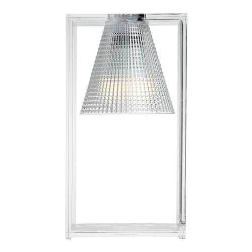 Transparent geometric lamp with a textured silver shade, creating a modern and sleek aesthetic.