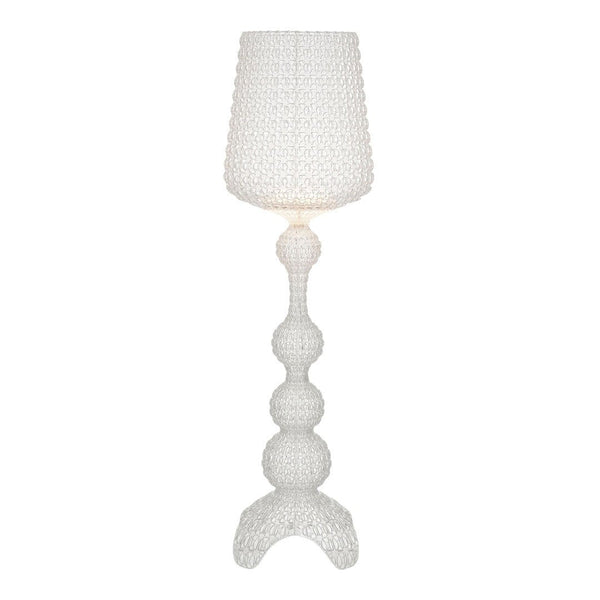 White textured lamp with a round base and cylindrical shade, featuring a modern and whimsical design.