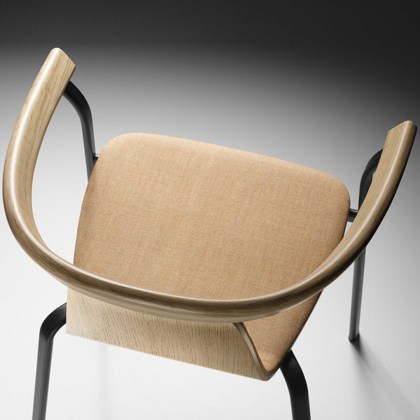 Beige upholstered chair with a light wood armrest, featuring a sleek black metal frame and minimalist design.