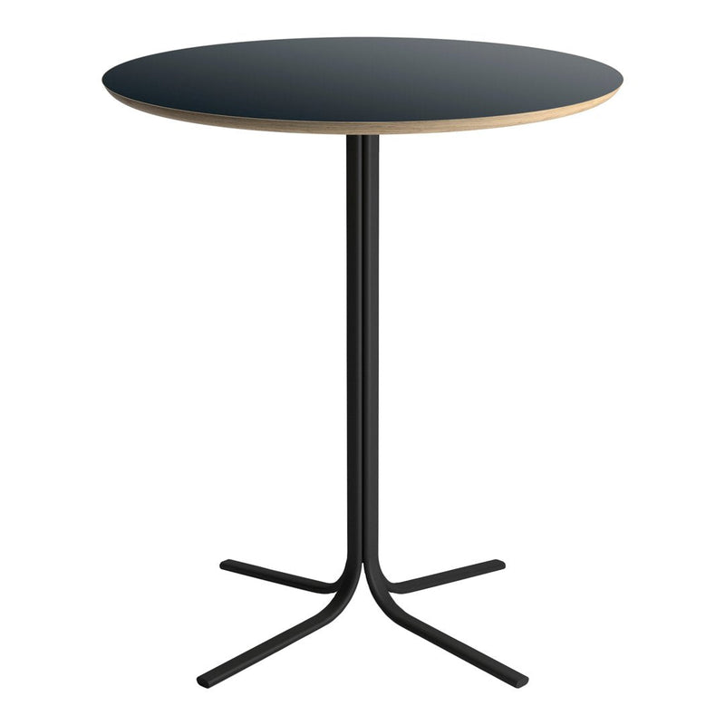 Round table with a sleek black top and natural wood edge, supported by a minimalist black metal base.
