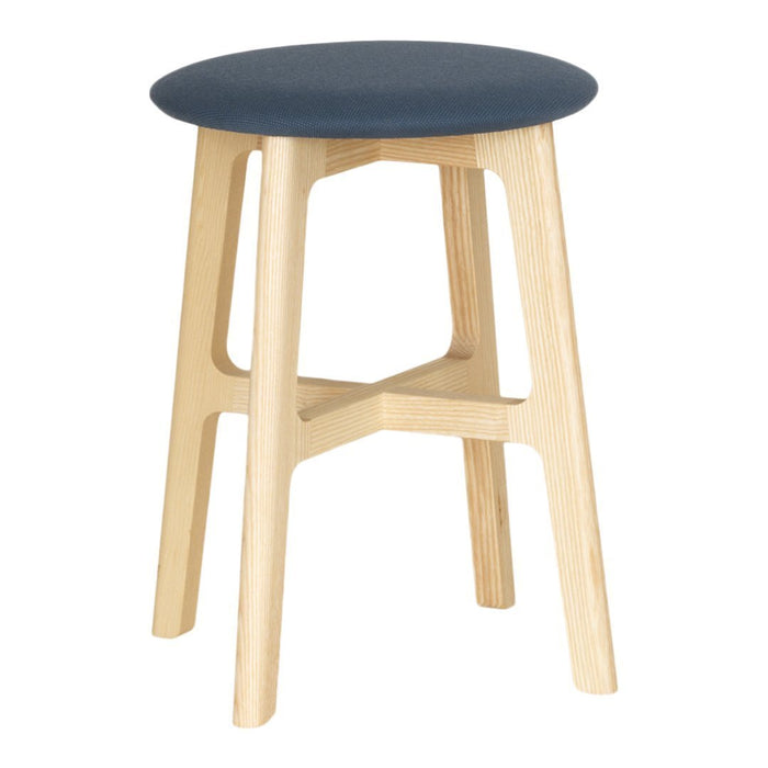 Blue cushioned stool with natural wood legs, featuring a smooth, minimal design. Ideal for modern spaces.