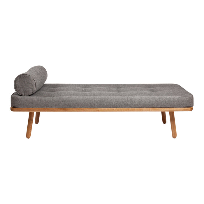 Gray tufted chaise lounge with a rounded bolster pillow and natural wood legs. Sleek, modern design for stylish decor.