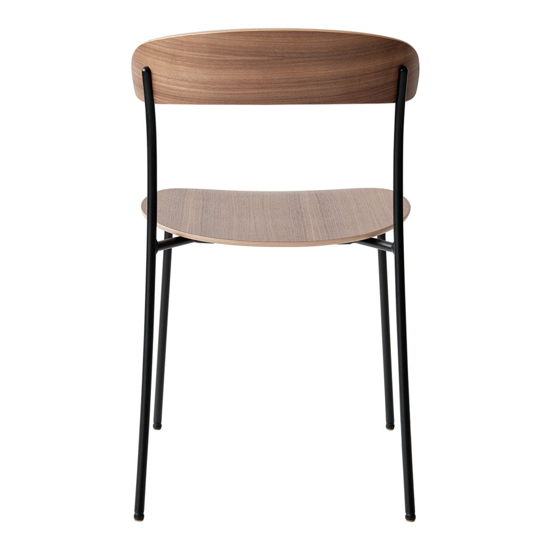 "Wooden chair with a warm brown finish and sleek black metal legs, showcasing a modern minimalist design."