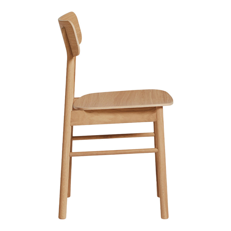 Side view of a natural wood chair with a minimalist design and smooth finish, showcasing its light oak color and clean lines.