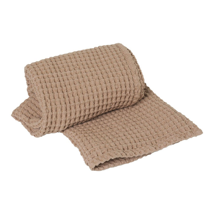 Woven taupe blanket with a textured pattern, perfect for adding warmth and style to any space.