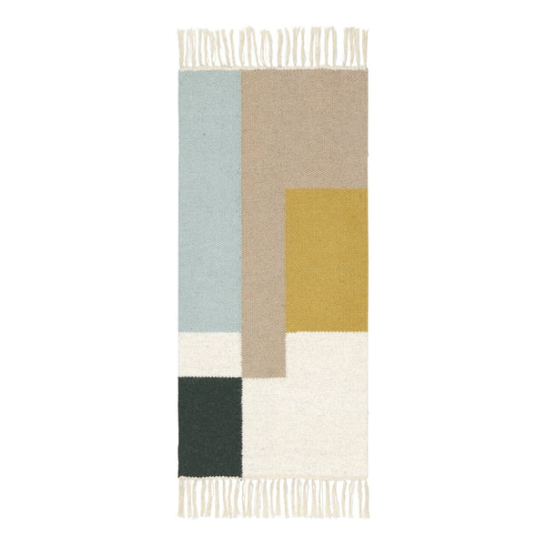 Geometric rug featuring soft blue, beige, mustard yellow, dark green, and cream colors with fringe detail.
