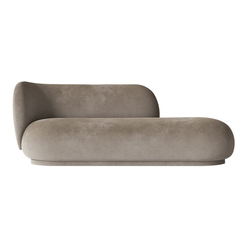 Soft beige chaise lounge with smooth, rounded edges and a minimalist design. Perfect for modern decor.
