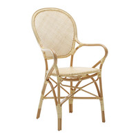 Natural rattan chair with a woven pattern in light beige, showcasing a classic, airy design.