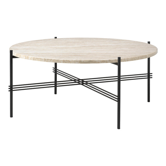Round coffee table with a light beige stone top and black metal legs featuring a geometric cross-pattern design.