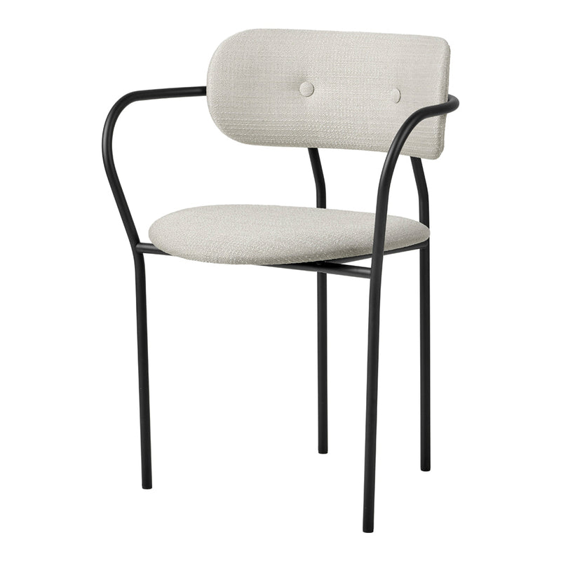 Stylish chair with a soft beige upholstery and sleek black metal frame, featuring a minimalist design and subtle button detail.