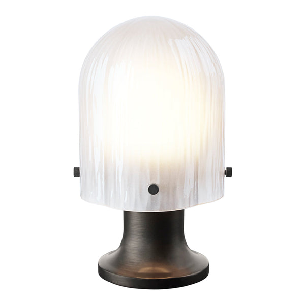 White ribbed glass lampshade on a sleek black base, creating a modern and elegant design. Ideal for chic interiors.