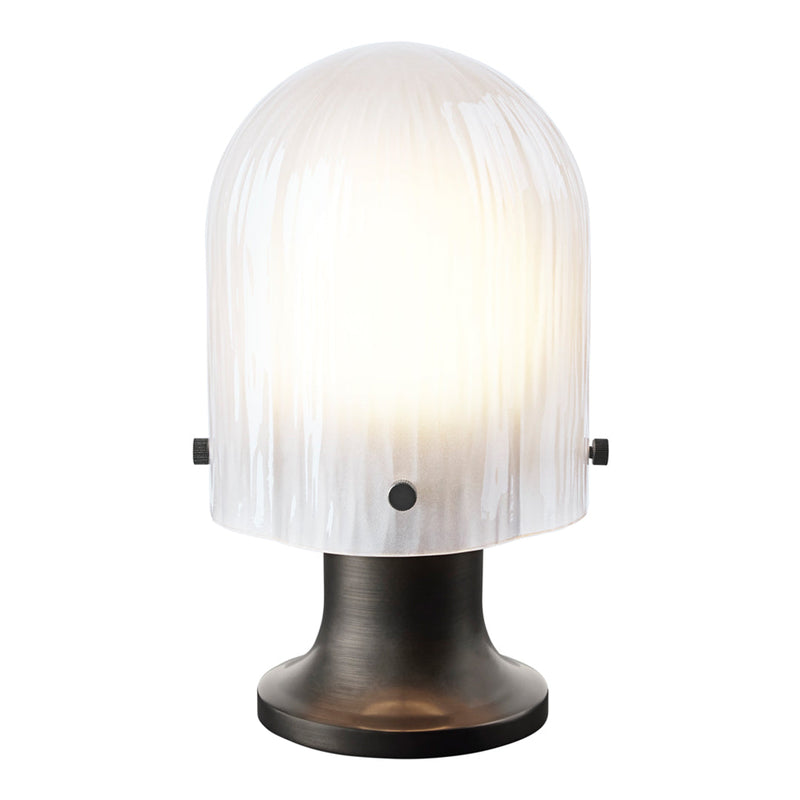 White ribbed glass lampshade on a sleek black base, creating a modern and elegant design. Ideal for chic interiors.