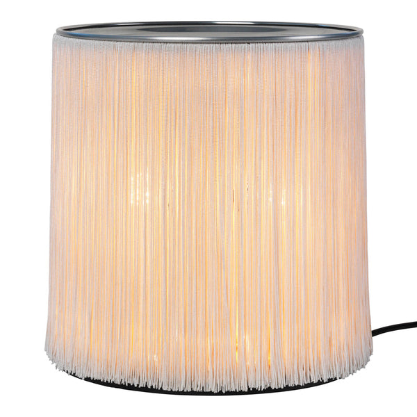 Translucent white fringe lamp with a soft glow, featuring a sleek silver top and minimalist design. Perfect for modern decor.