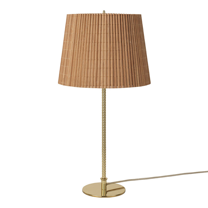 Gold base table lamp with a pleated tan shade, combining elegance and modern design. Perfect for stylish interiors.
