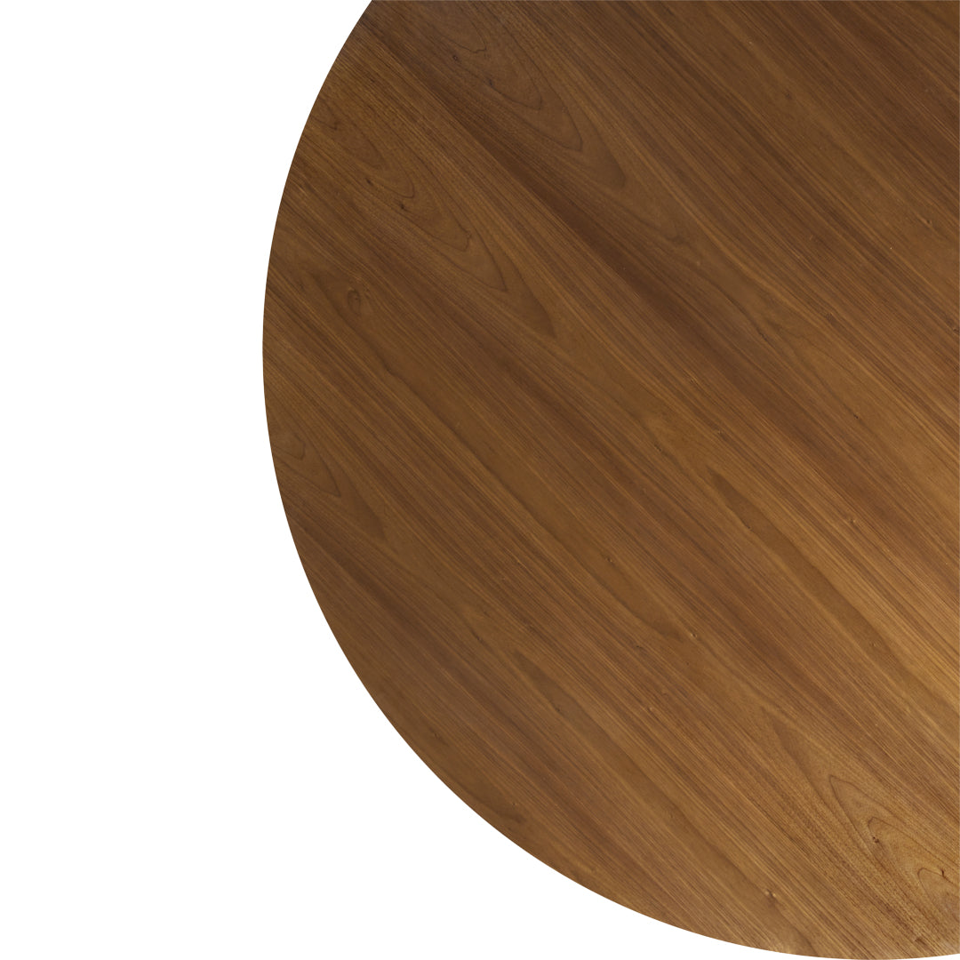Round wood table surface in warm brown tones with a smooth, natural grain pattern.