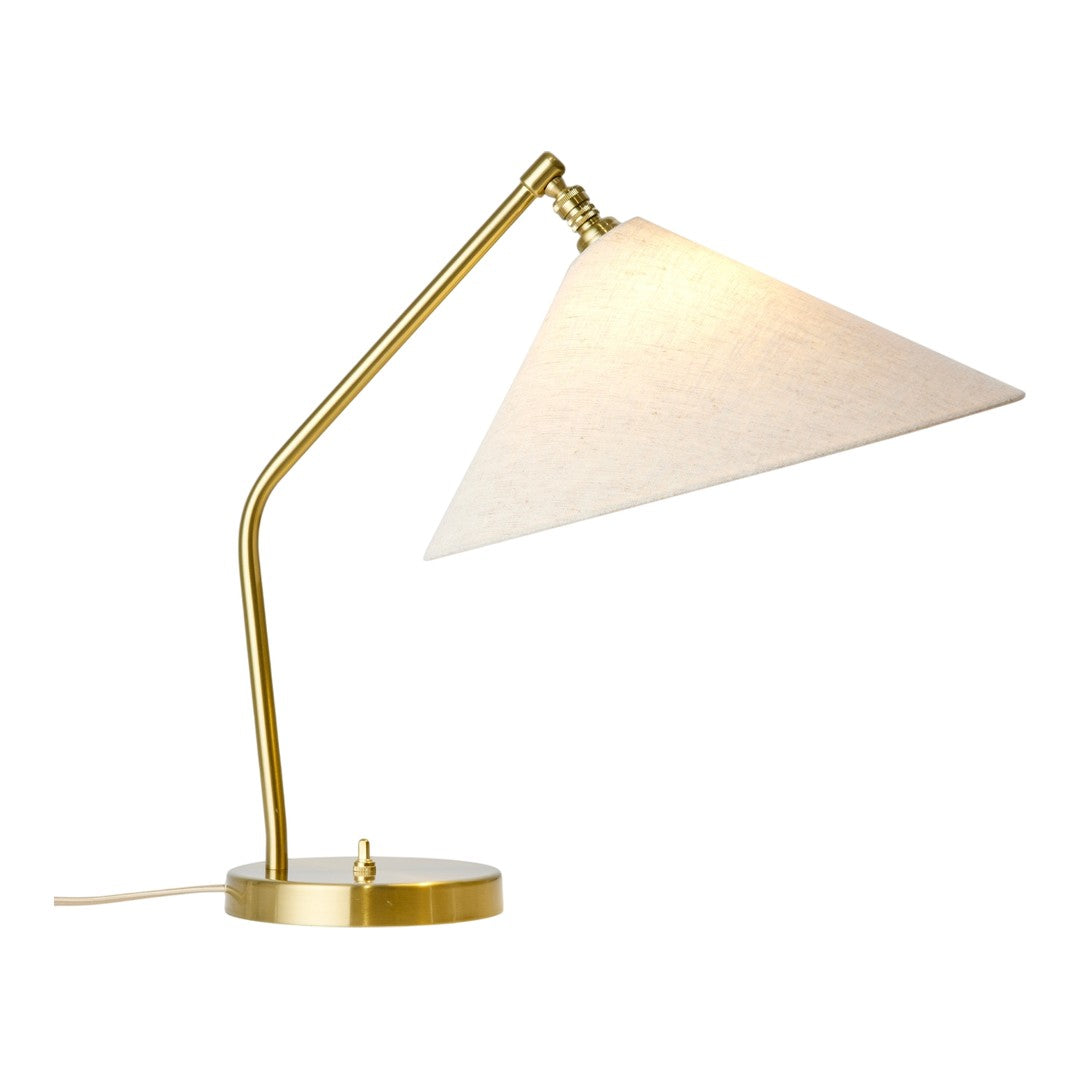 Gold metal desk lamp with a cream-colored fabric shade in a sleek, modern design.