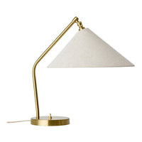 Gold metal base with a cream linen conical shade for a modern desk lamp design.