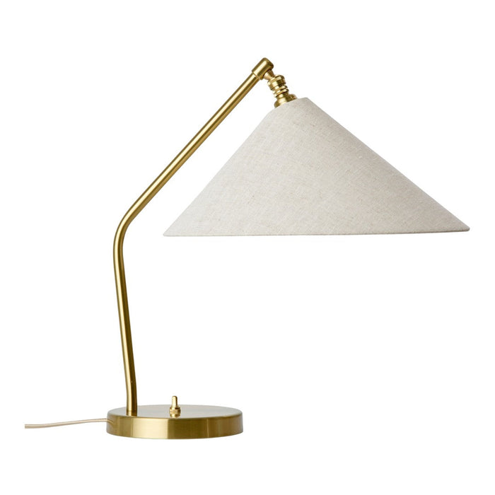 Gold metal base with a cream linen conical shade for a modern desk lamp design.