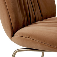 Brown velvet chair with vertical tufted pattern and sleek metallic frame. Elegant and modern addition to any space.