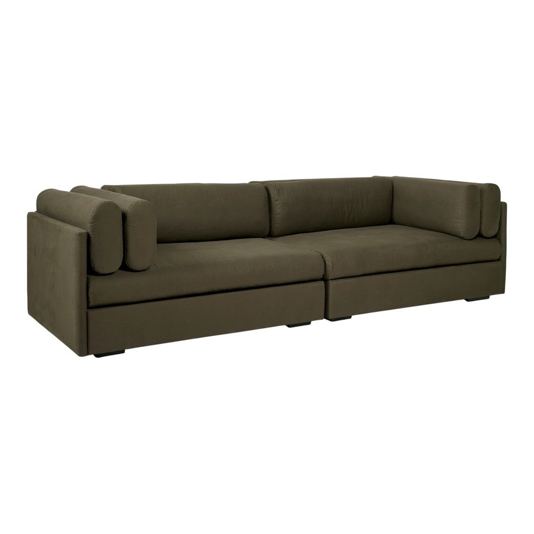 Olive green sectional sofa with smooth fabric and relaxed, modern design. Features matching cylindrical cushions.
