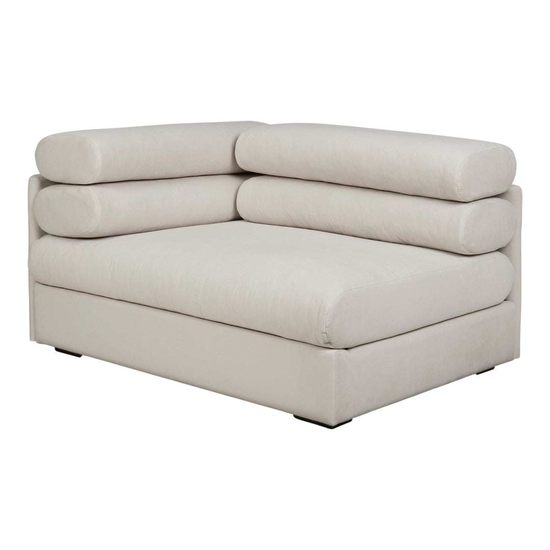Beige sectional sofa with smooth upholstery and rounded cushions, offering a modern, minimalist design.