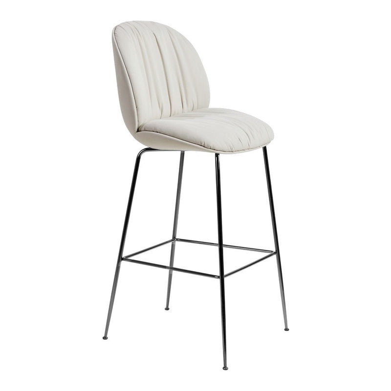 Cream-colored bar stool with vertical quilted pattern and sleek chrome legs. Perfect for modern interiors.