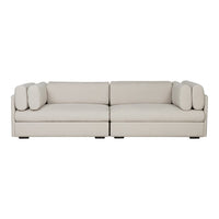 Light gray modern sofa with soft, smooth fabric and rounded cushions, creating a minimalist and elegant look.