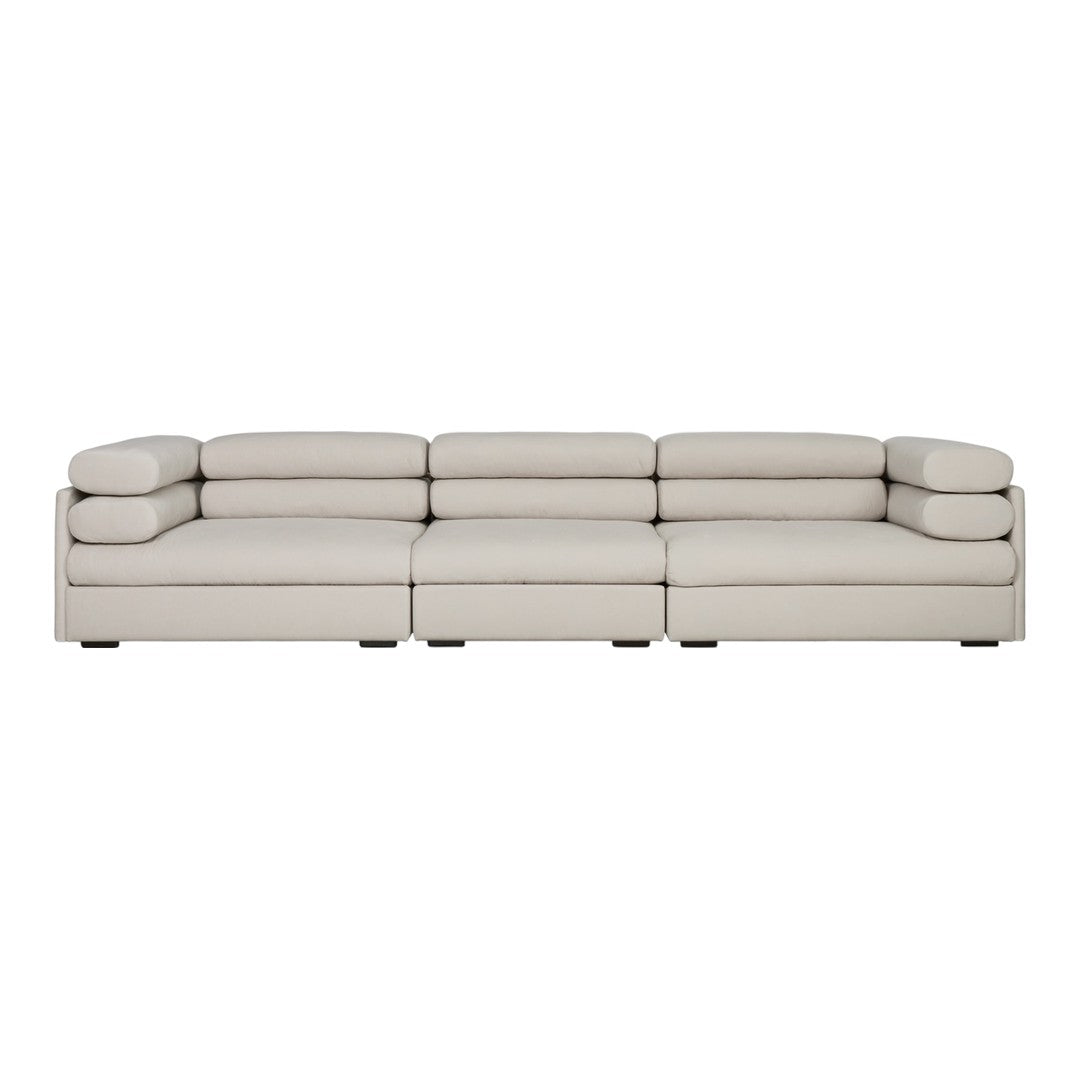 Elegant light beige sectional sofa with smooth, minimalist design and plush cushions for a modern living space.
