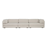 Light beige sectional sofa with smooth upholstery and subtle, contemporary design. Perfect for modern living spaces.