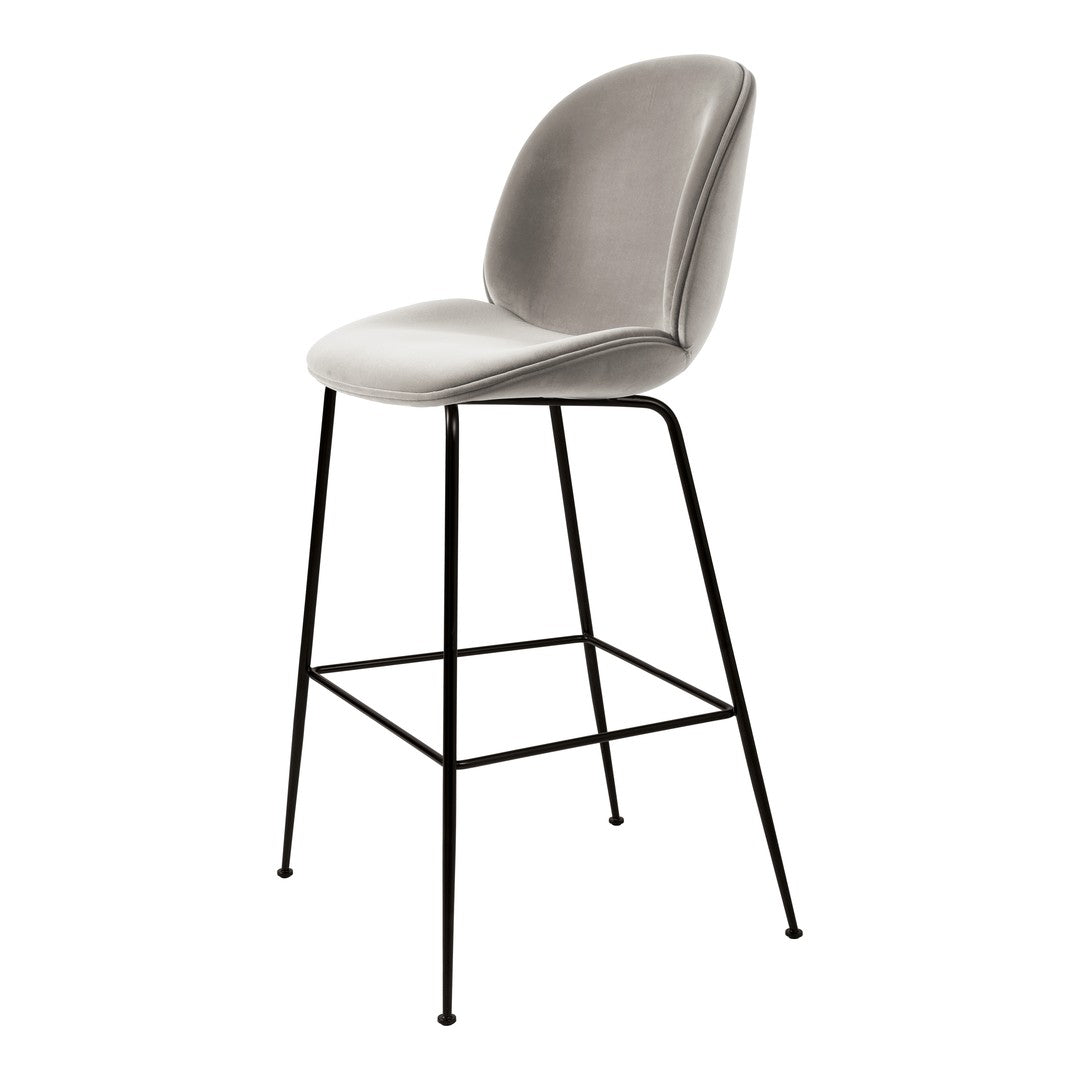 Gray upholstered bar stool with smooth curves and sleek black metal legs, perfect for modern decor.