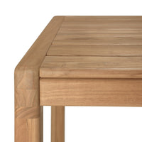 Light brown wooden table with a smooth, slatted surface and rounded corners, showcasing natural wood grain patterns.