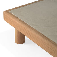 Natural wood table edge with a smooth light gray surface, featuring simple, modern design and clean lines.