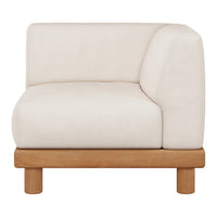 Minimalist cream upholstered armchair with a rounded corner and light wooden base. Perfect for modern decor.